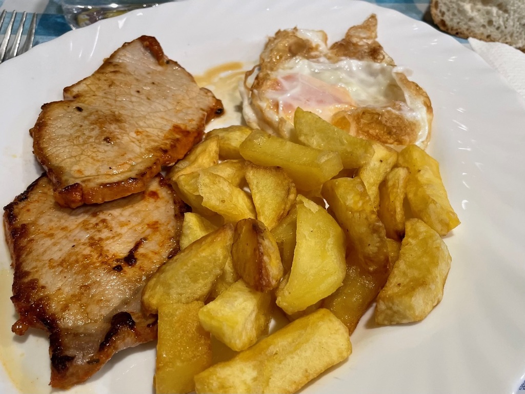 Pork steak with fries. The fried egg was an unexpected touch.