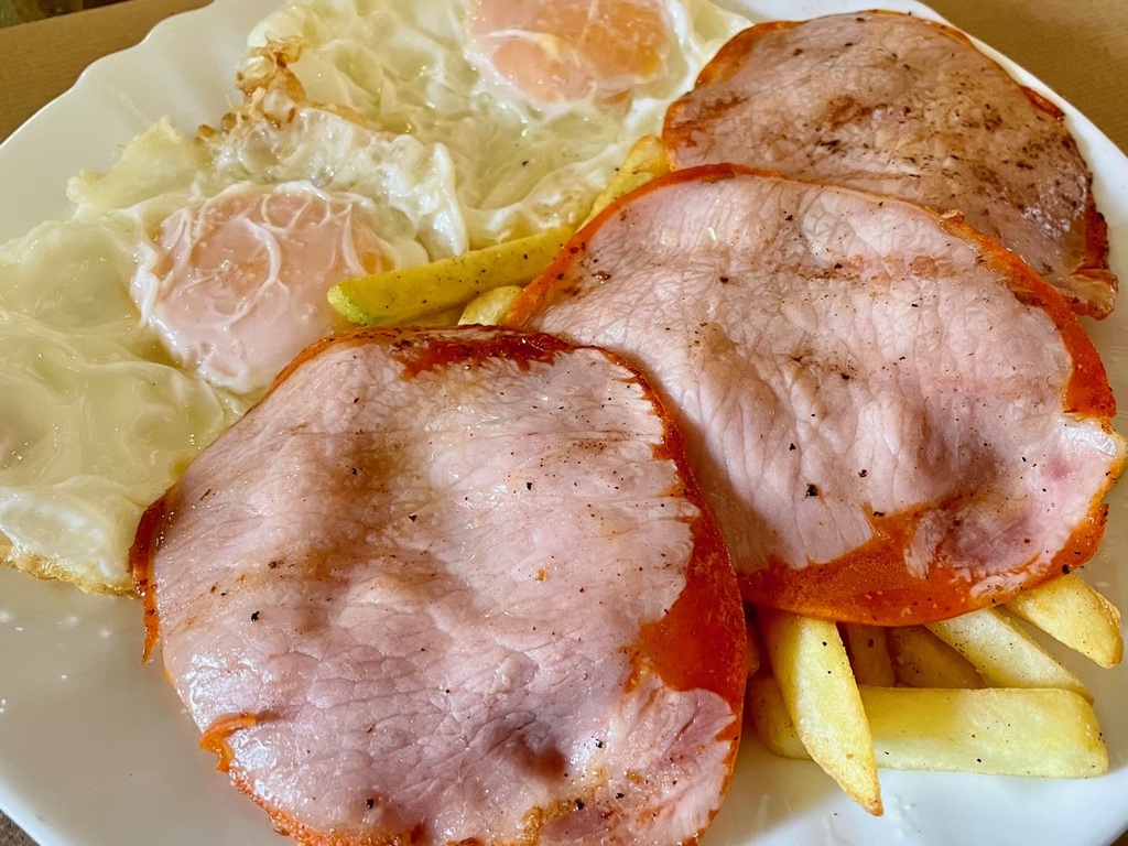 I have a new appreciation for these egg, meat, and potatoes combo plates that I’ve noticed on lunch menus. They’re inexpensive and filling. This one from yesterday had pork loin. I had a similar one today with bacon.